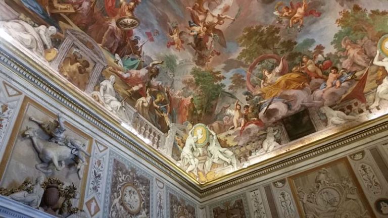 A mural on the ceiling in the Galleria Borghese depicting flying horses, angels and humans