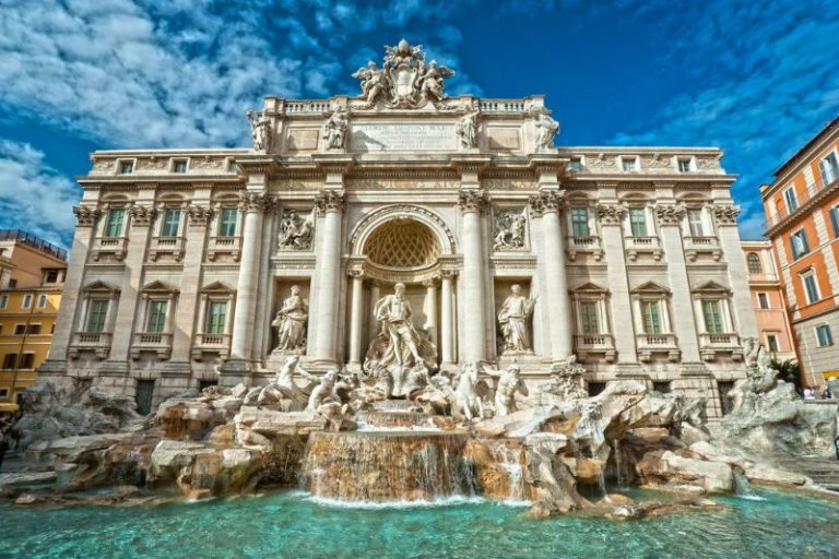 The Trevi Fountain in Rome with life-like sculptures and a mini waterfall